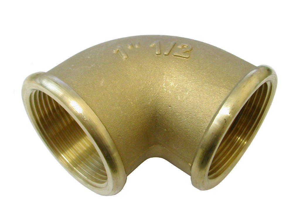 Brass elbow pipe fitting on a white background