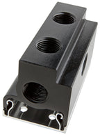 Black metal component with multiple threaded holes on a white background