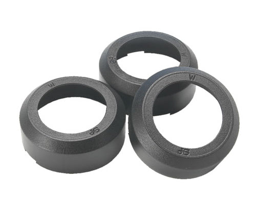 Three black rubber washers on a white background